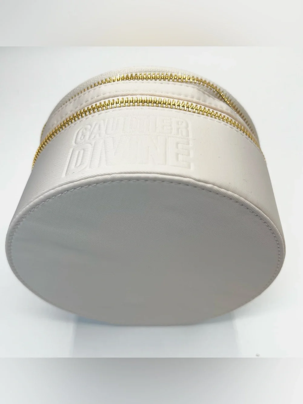 Gaultier Divine Vanity - Round Cosmetic Bag with Gold Accents in Cream